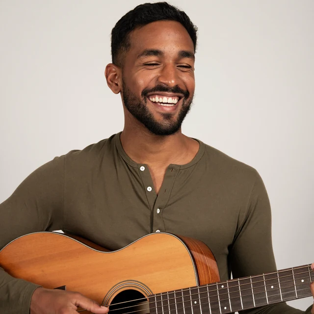 Worship leader playing guitar